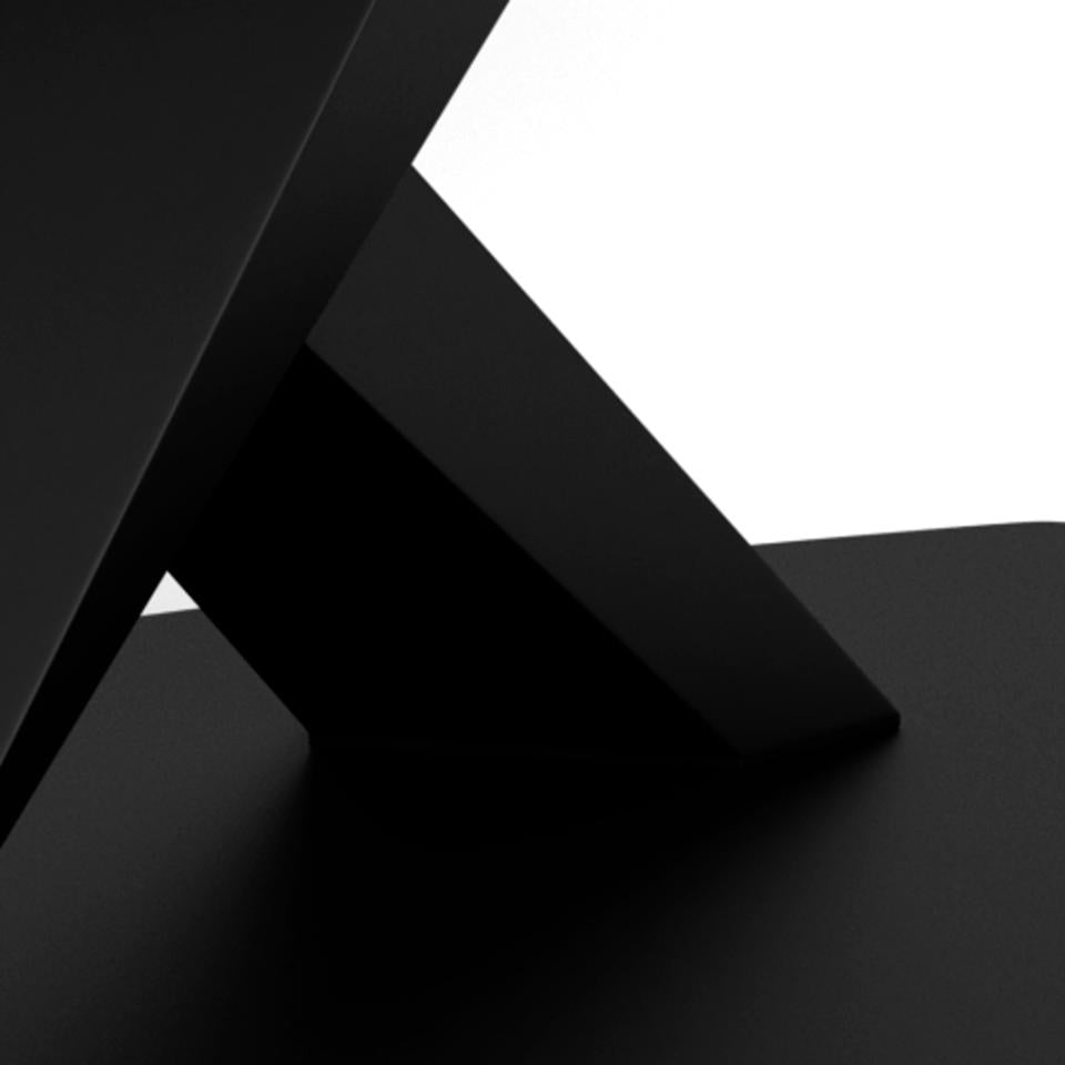 Black geometric cross legs on a reflective surface with a white background