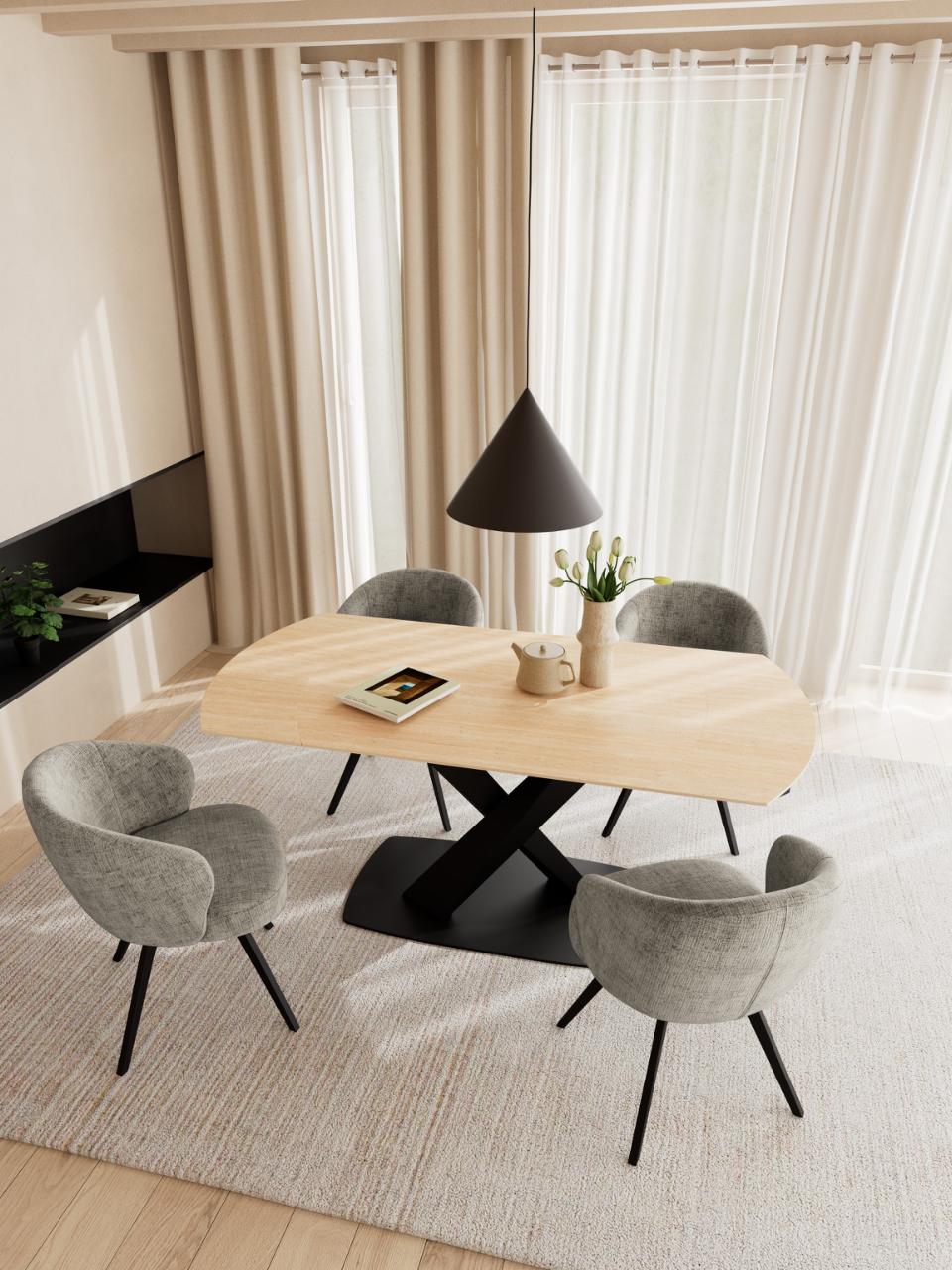 A modern Morella dining set featuring a beige ceramic rectangular table with a black X-shaped base, surrounded by four gray upholstered chairs with black legs, set on a textured light rug in a bright room with sheer curtains.