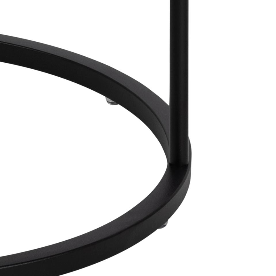 Close-up of a black metal chair frame on a white background