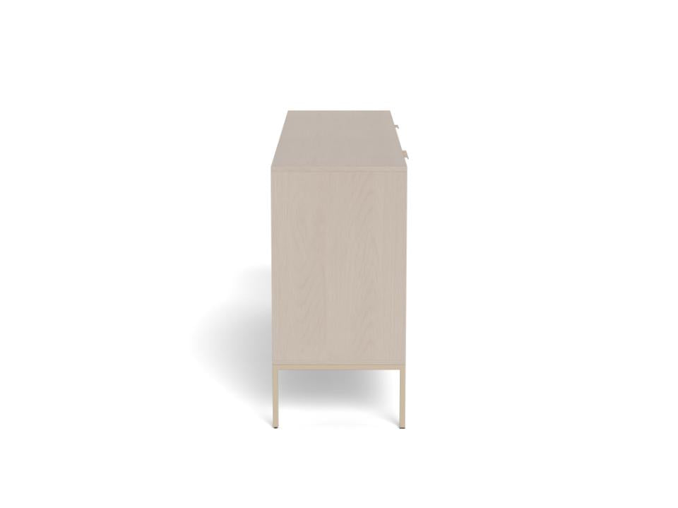 side view of a Seaford sideboard or cabinet in a grey finish with slim legs on a white background.