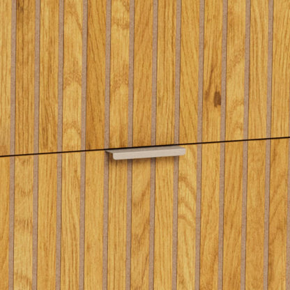 Close-up of a modern cabinet door with vertical wood grain panels and a slim horizontal metal pull handle.