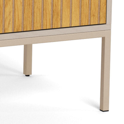 Close-up of a modern Seaford sideboard showing a grey frame, vertical lamella front door, and a single leg on a white background.