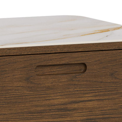 Close-up of a wooden Southampton sideboard with a dark brown wood grain front and a light beige marble-patterned ceramic top, featuring a recessed handle cutout.
