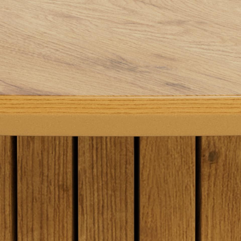 Close-up of a light natural wood tabletop meeting a slatted wood base, showing grain texture and warm tan tones.