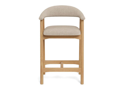 Bar stool with beige cushioned seat and backrest on a white background