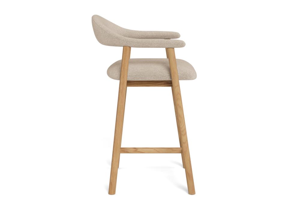 Addi bar stool with beige cushioned seat and backrest on a white background