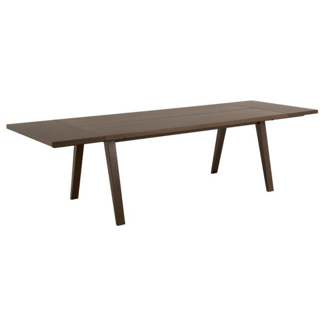 Wooden dining table with metal legs on a white background