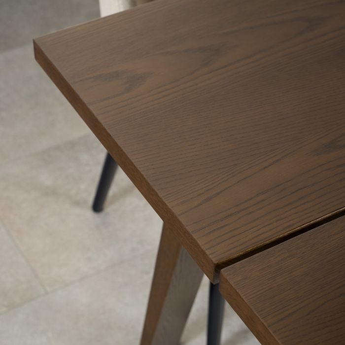 Close-up of a wooden table with a blurred background
