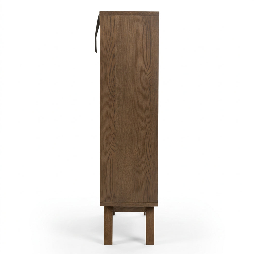 Side view of a tall, narrow wooden cabinet or storage unit in a medium brown finish with visible wood grain, shown against a plain white background.