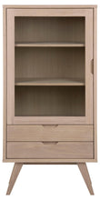 Load image into Gallery viewer, A mid-century modern wooden cabinet with a light oak finish, featuring a glass-front upper door with two shelves, two drawers below, and angled legs.
