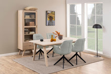 Load image into Gallery viewer, Dining room with wooden table and chairs near a large window.
