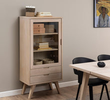Load image into Gallery viewer, Wooden display cabinet with glass doors in a room with a table and chairs.

