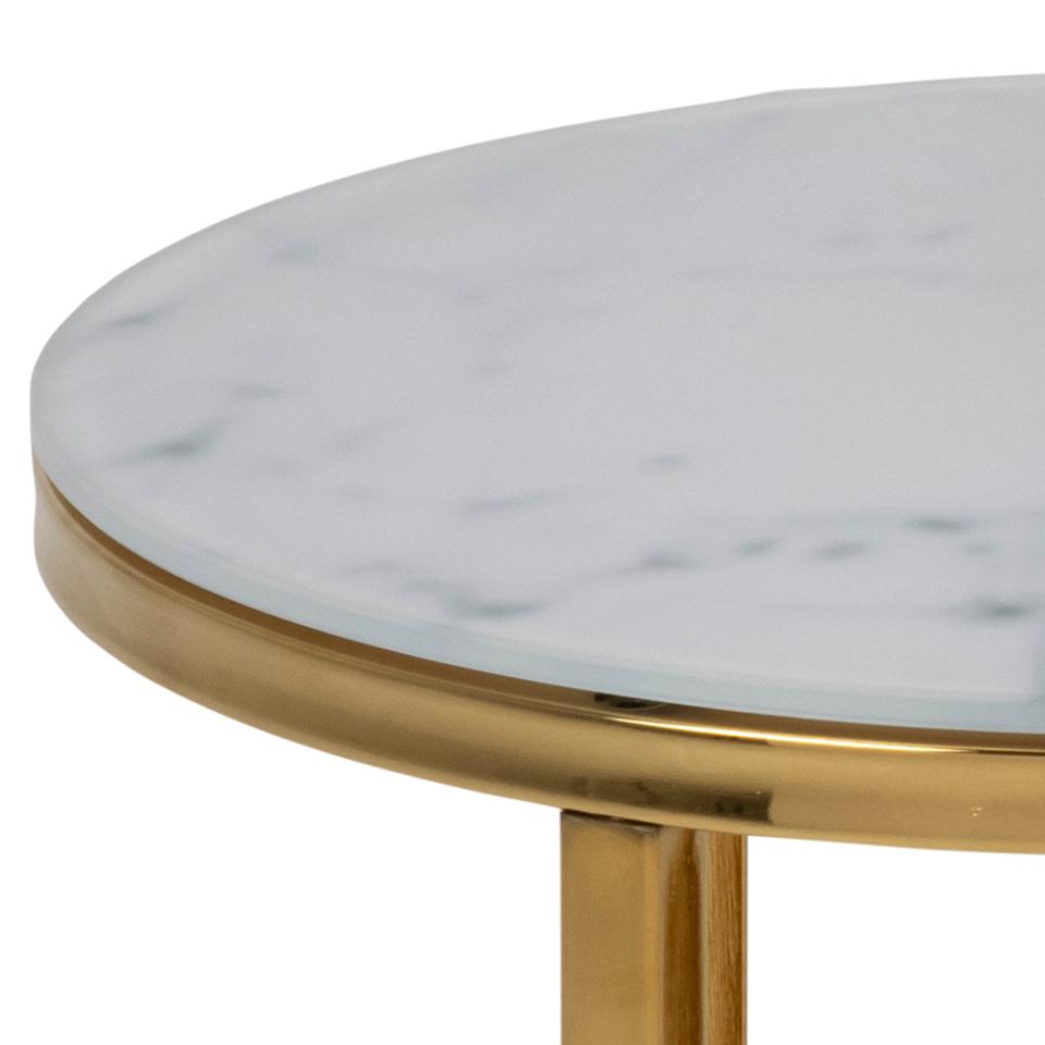 Round table with marble top and gold base on a white background