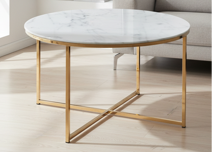 Round marble coffee table with gold legs in a living room setting
