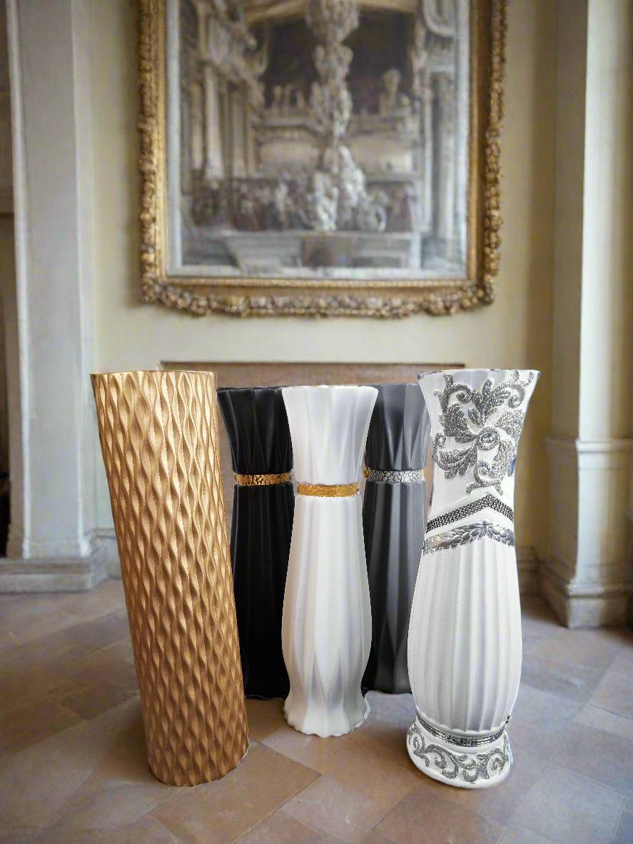 5 ceramic vases in different designs and colours in a regal setting