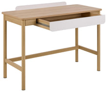 Load image into Gallery viewer, A modern writing desk with a light natural wood frame and a white drawer front, shown with one drawer pulled open against a plain white background.
