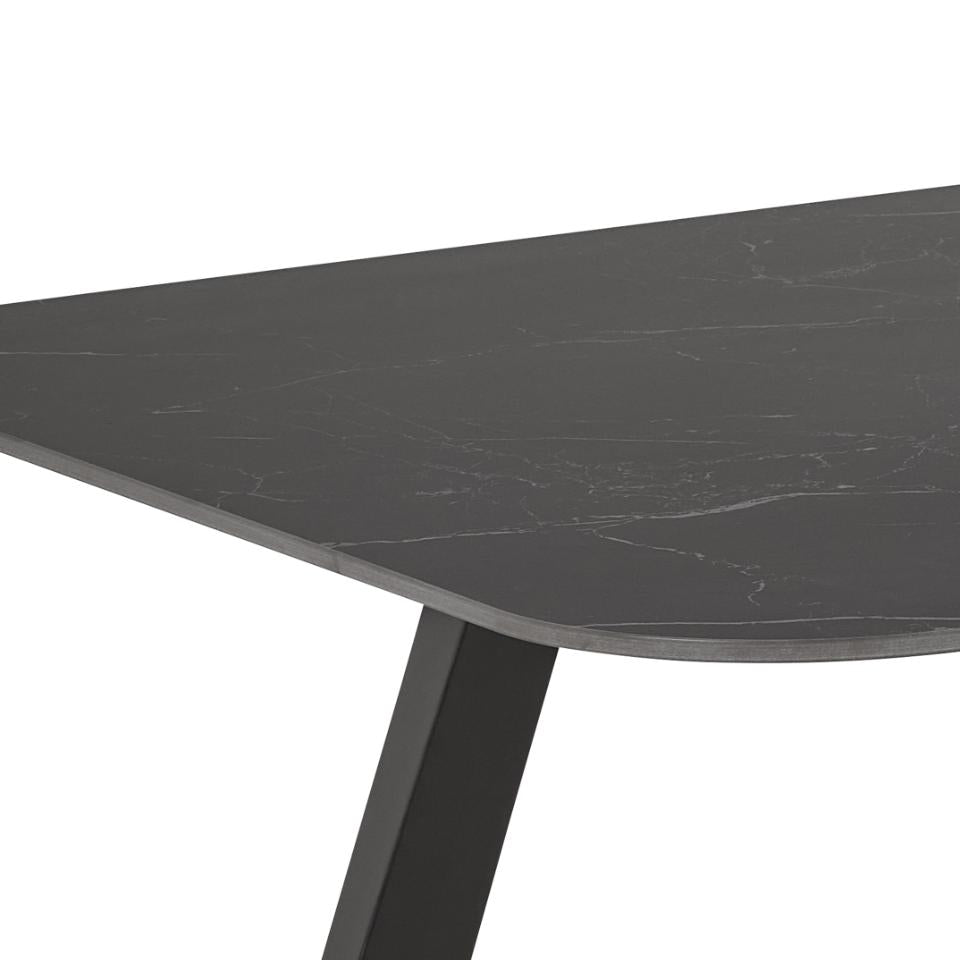 Close-up of a dark gray table with a white background