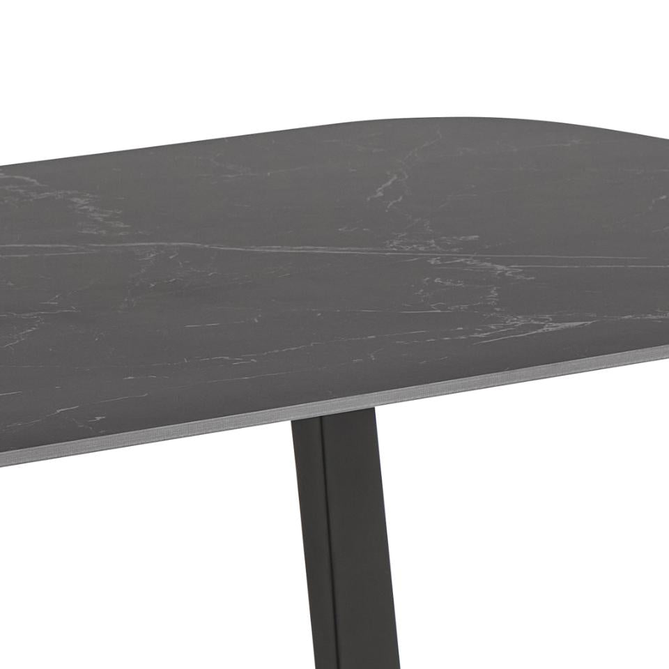 Round dark gray marble table with a black metal base on a white background