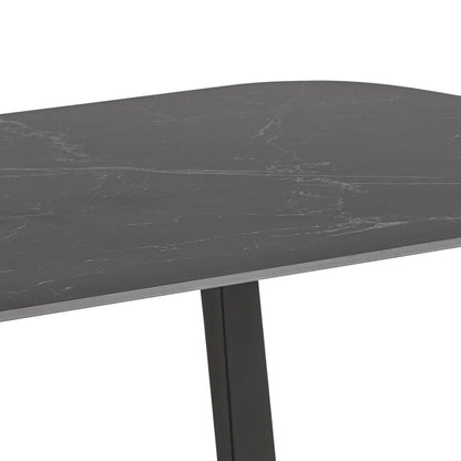 Round dark gray marble table with a black metal base on a white background