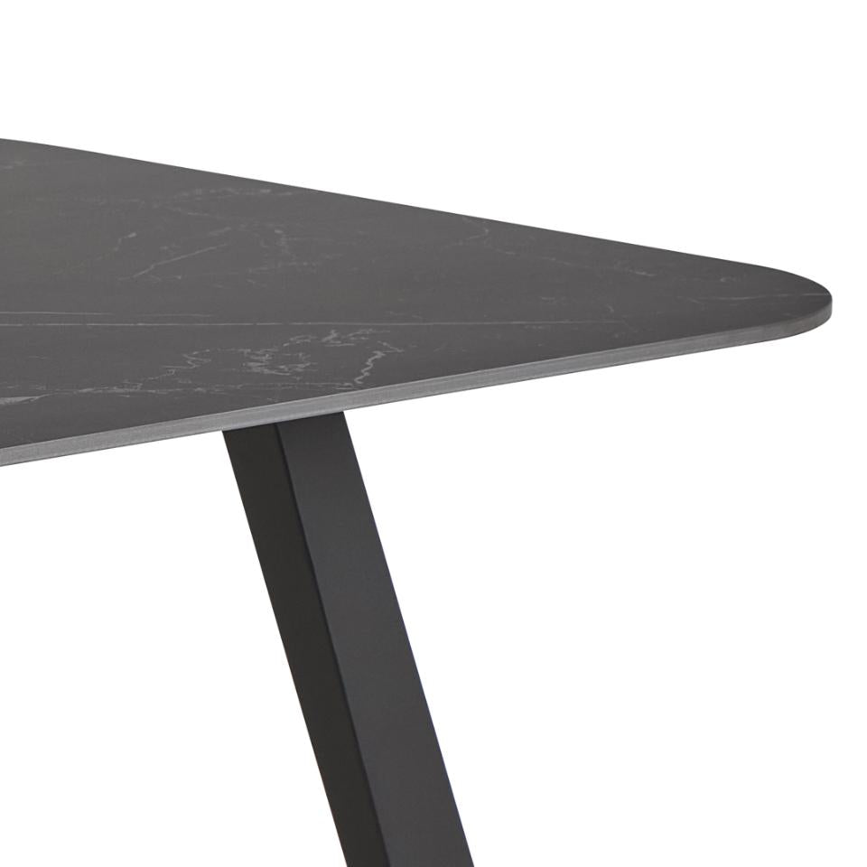 Black marble table top with a white background
