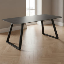 Load image into Gallery viewer, Black dining table with a minimalist design on a white background
