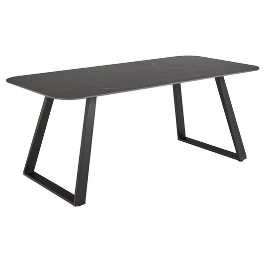 Black dining table with a minimalist design on a white background
