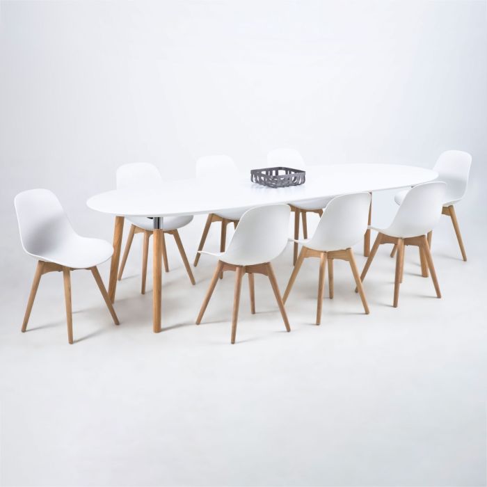 Dining table set with white chairs and wooden legs on a white background