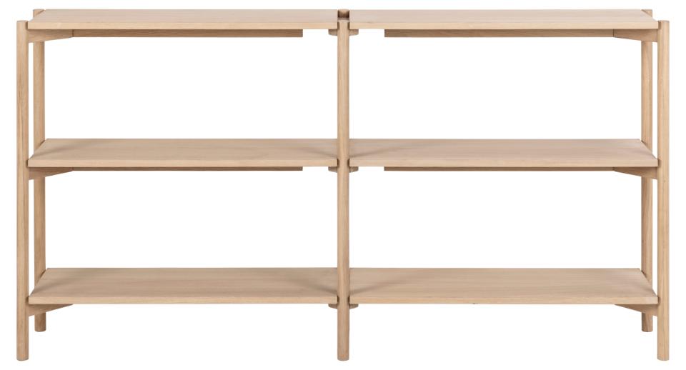 A light natural wood modular shelving unit with four open shelves and a central divider, shown against a plain white background.