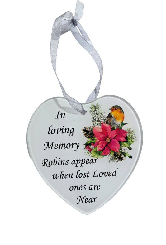 A heart-shaped glass hanging decoration with a poinsettia flower and a robin image, with the text 'In Loving Memory. Robins appear when lost loved ones are near'.