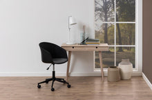 Load image into Gallery viewer, Modern office setup with a desk, chair, and decor in a room with a large window.
