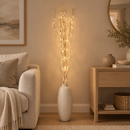 Cream illuminated willow twigs styled in a warm modern living room