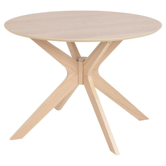 A round dining table with a wooden top and angled legs, with a simple, modern design.