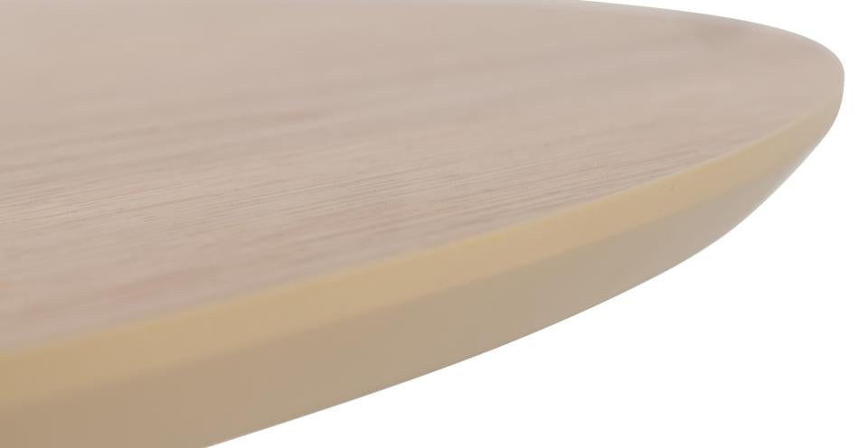 Close-up of a round wooden table surface with a beige color.