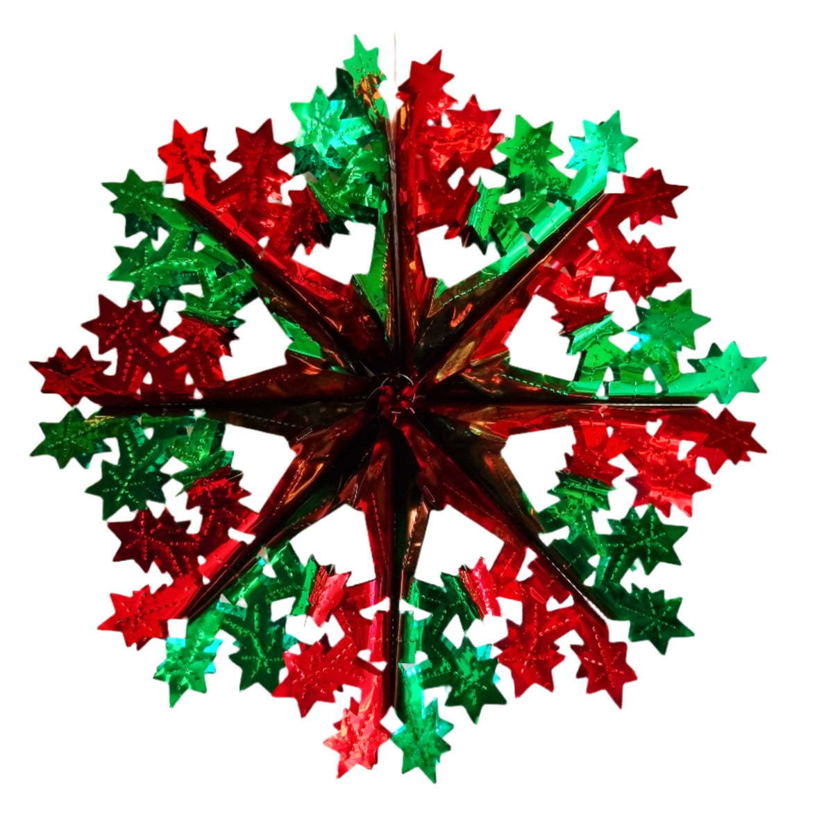 a red and green Christmas star foil decoration on a white background