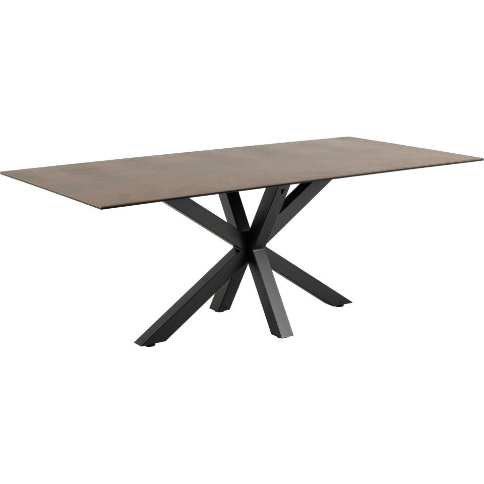 Dining table with ceramic brown top and black metal legs on a white background