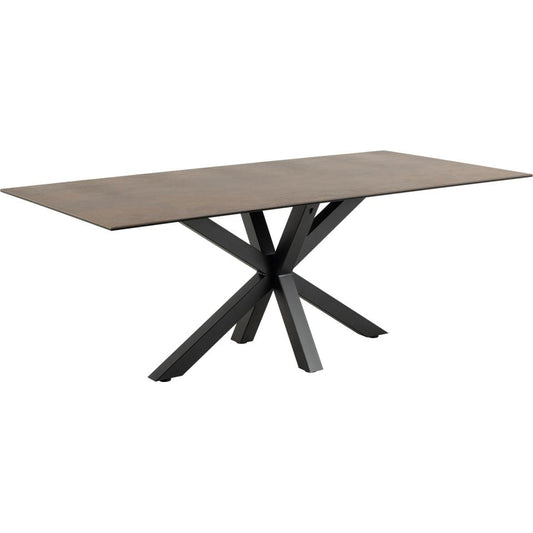 Dining table with ceramic brown top and black metal legs on a white background