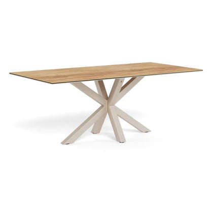 A rectangular dining table with a light oak wood grain top and a light beige X-shaped metal base, shown on a solid white background.