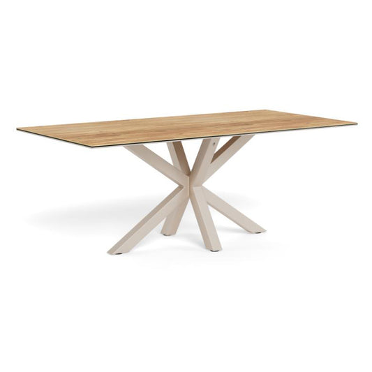 A rectangular dining table with a light oak wood grain top and a light beige X-shaped metal base, shown on a solid white background.