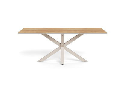 A rectangular dining table with a light oak wood top and a white painted metal X-shaped base, shown on a solid white background.