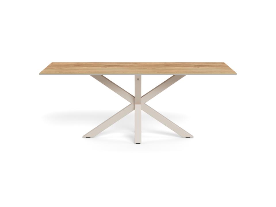 A modern rectangular dining table with a light oak wood top and a white painted metal X-shaped base, shown on a solid white background.