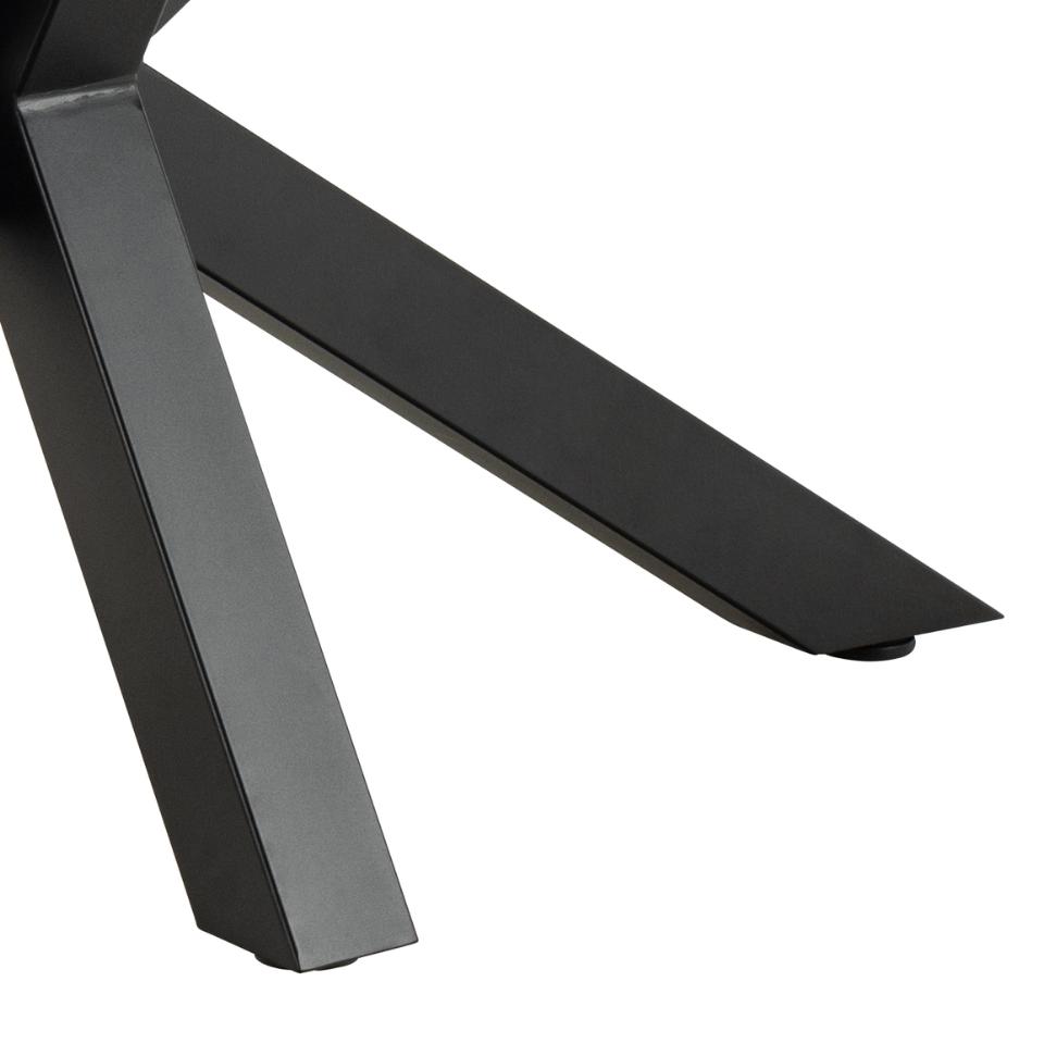 Close-up of a black metal table leg on a white background