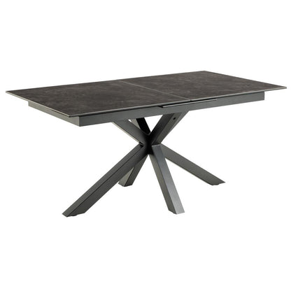 A modern rectangular dining table with a black ceramic top and a matching black X-shaped metal base, shown on a plain white background.