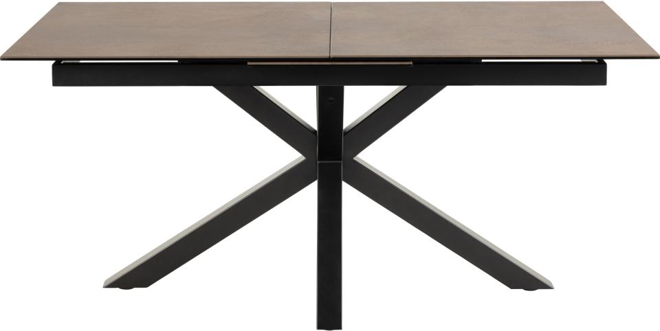 A modern rectangular dining table with a dark brown ceramic top and a black metal X-shaped base, shown on a plain white background.