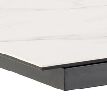 Load image into Gallery viewer, Close-up of a modern table corner showing a white marble-look top with subtle gray veining and a matte black metal base.
