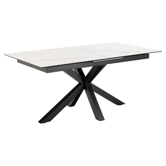 A modern extendable dining table with a white ceramic top and a black metal cross base.
