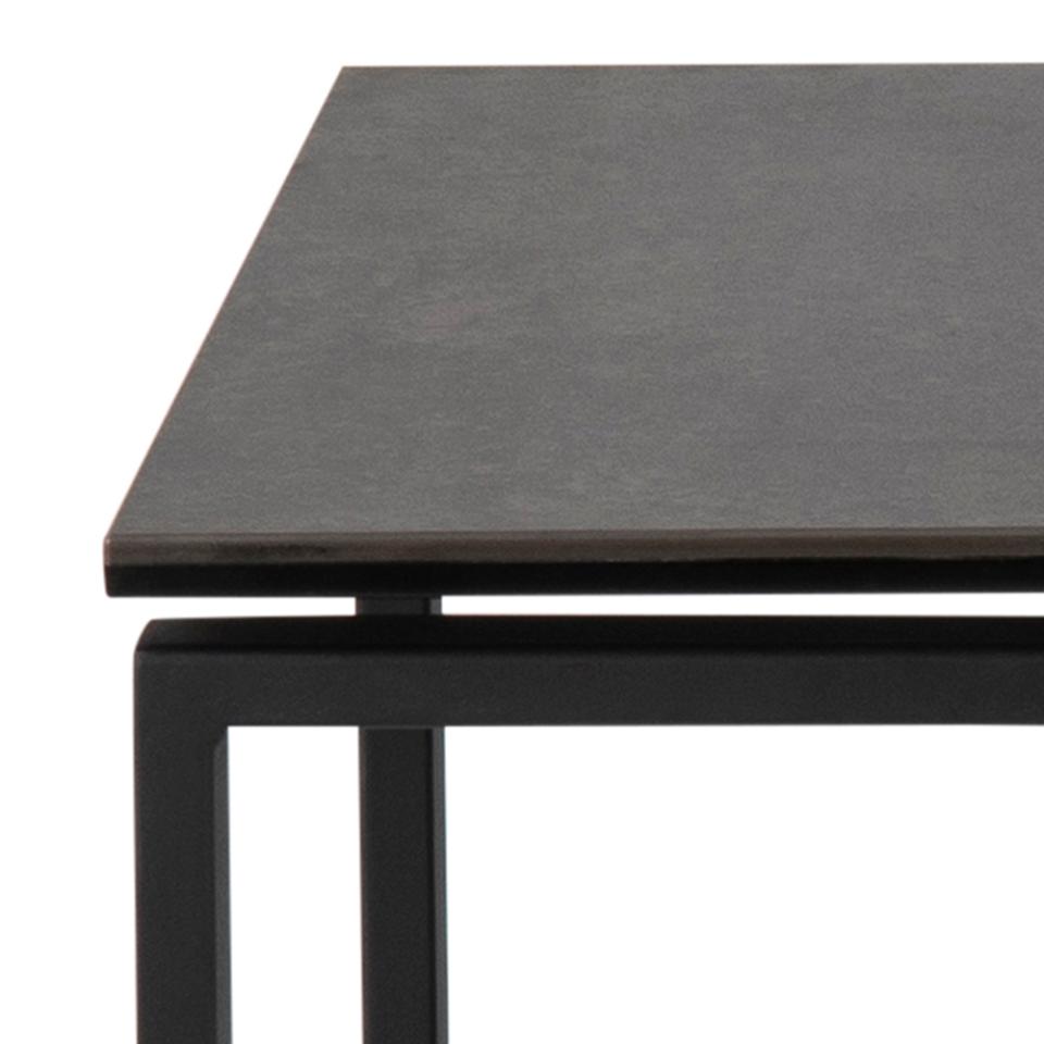 Dark gray rectangular table with black metal legs on a white background