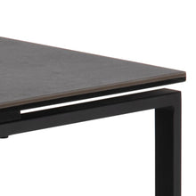 Load image into Gallery viewer, Close-up of a modern table with a dark gray top and black metal legs on a white background
