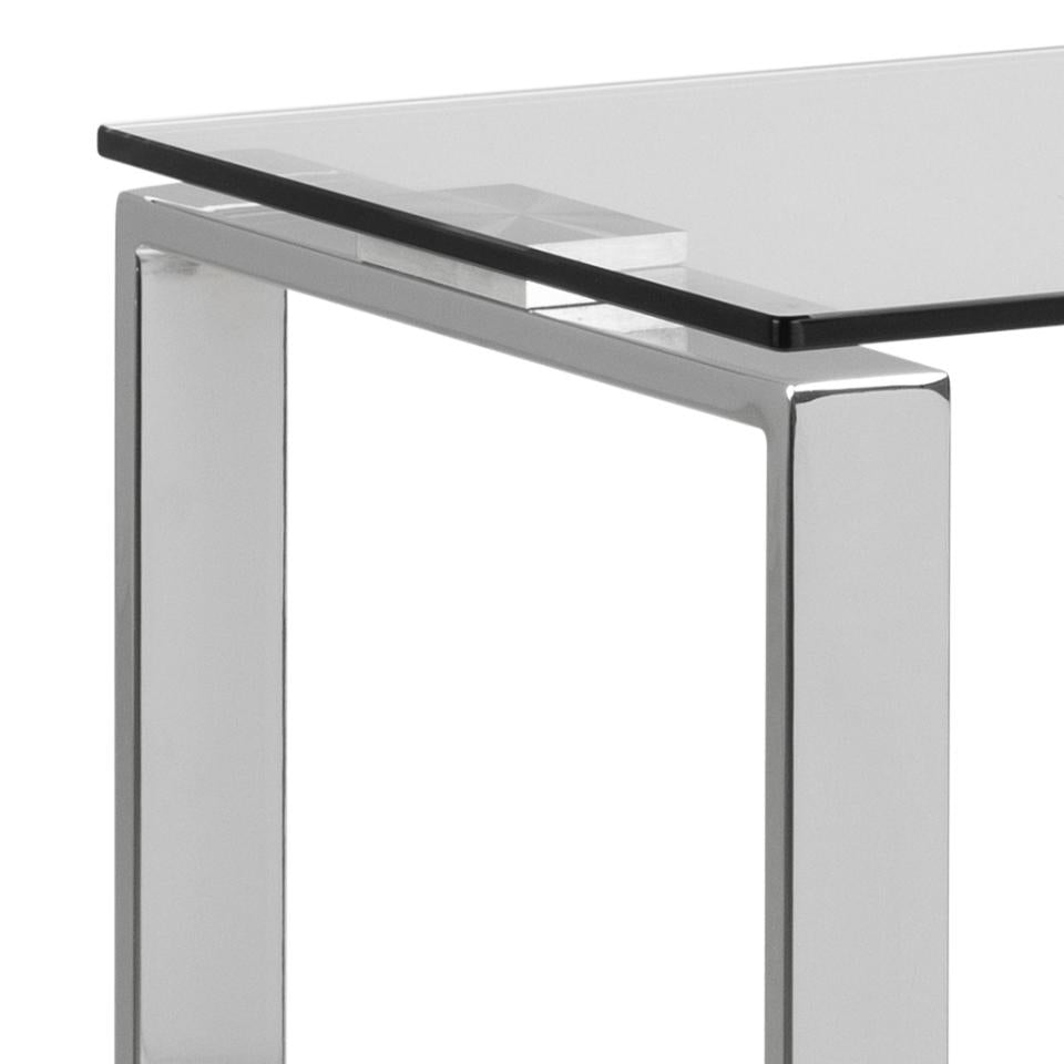 Glass table with metal frame on a white background