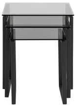 Load image into Gallery viewer, A set of three nested tables with black metal frames and transparent glass tops, shown against a plain white background.
