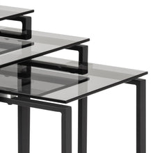 Load image into Gallery viewer, Set of black glass tables with a white background
